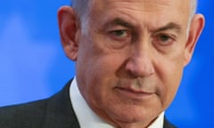 Closeup of Benjamin Netanyahu against a blue background. Photograph: Reuters/Ronen Zvulun
