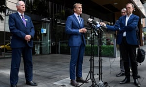 NSW transport minister Rob Stokes speaks to the media on Friday alongside Transport for NSW chief operations officer Howard Collins (left).