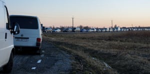 Vehicles line up at the Polish-Ukrainian border in Hruszów village, eastern Poland