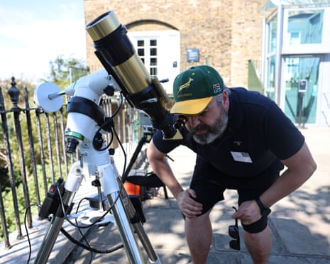 Astronomers set up observing equipment ahead of an eclipse event at Greenwich Observatory in London, Britain.