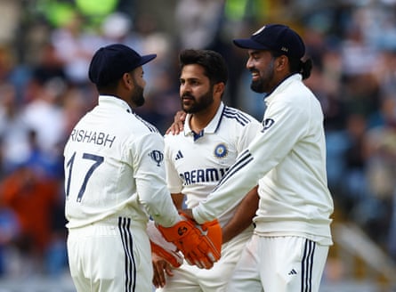 Shardul Thakur (centre) celebrates taking the wicket of Harry Brook