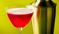 The rosy red Campari shakerato in a cocktail bowl martini glass and a cocktail shaker next to it.