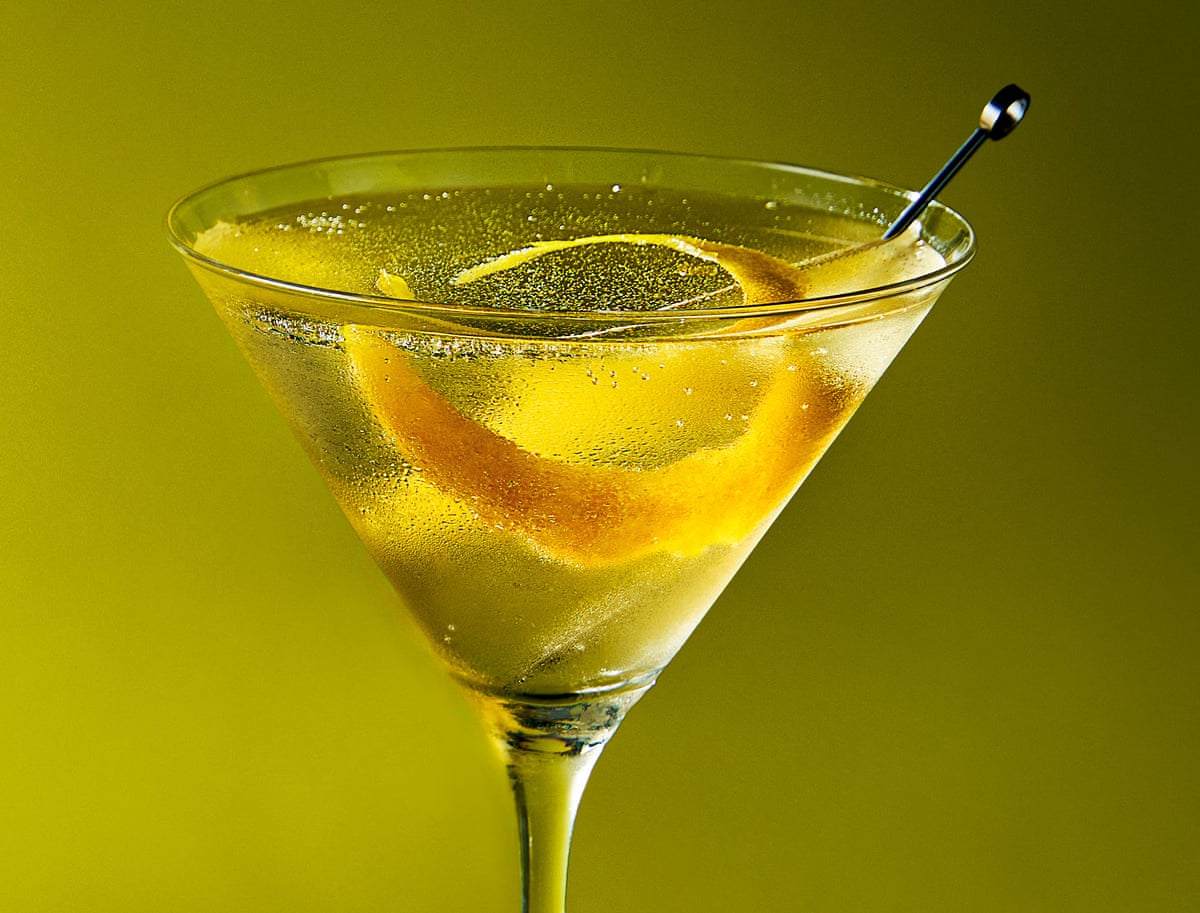 The Millionaire’s vodkatini and a peel of lemon in a martini glass.