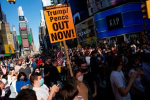 People celebrate at Times Square in New York after Joe Biden was declared winner of the 2020 presidential election on November 7, 2020.