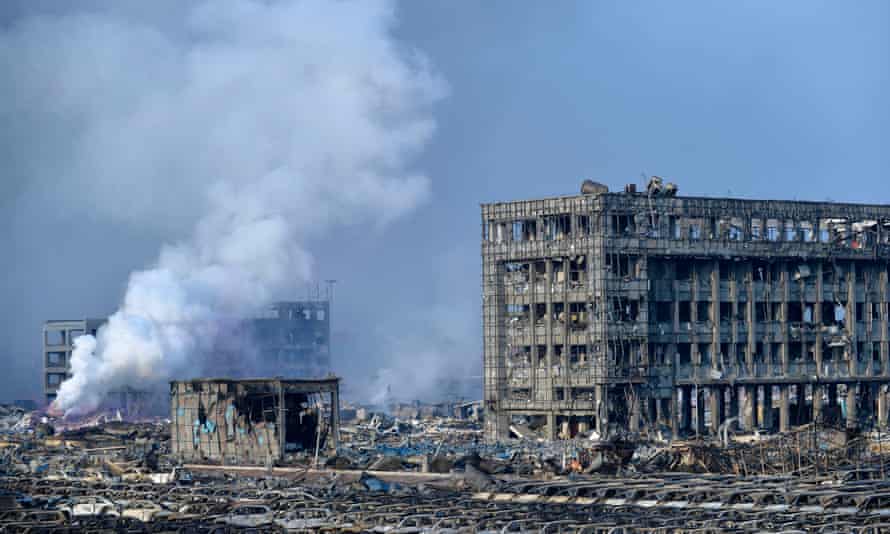 Buildings are destroyed by the deadly explosions in Binhai New Area in Tianjin. Fifty people were confirmed dead and hundreds of firefighters are still battling the blaze. 