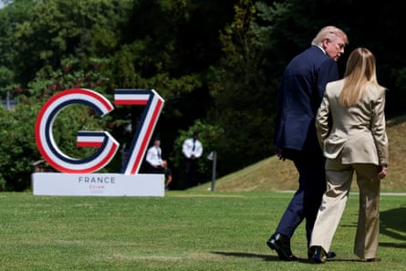 Donald Trump and Giorgia Meloni talk after posing for a group photo at the G7 summit