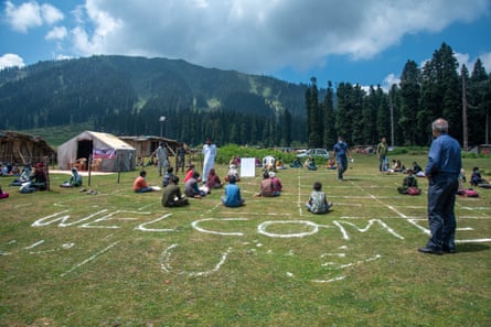 Teachers and students in meadow