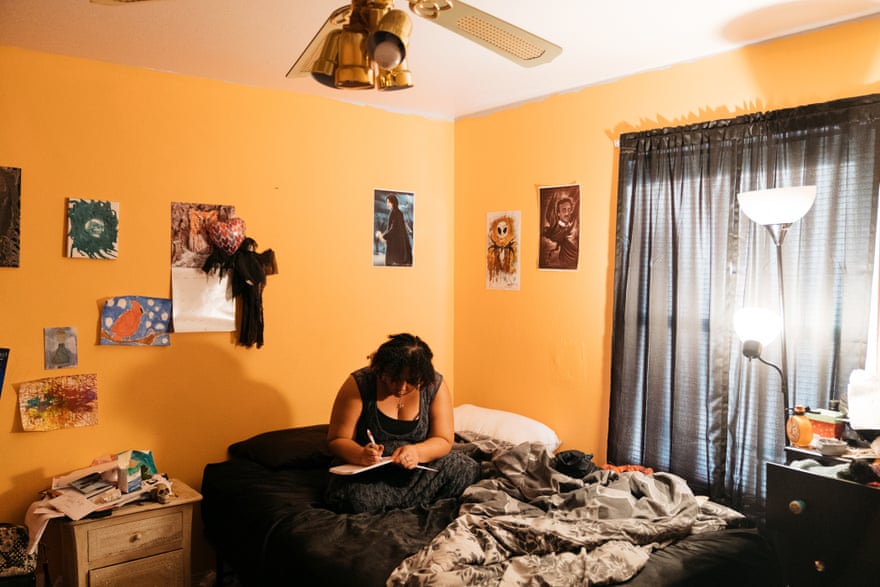 Tiffany Pennywell writes a poem in her bedroom in Shreveport. ‘There was a lot of crying on my part because I was torn,’ she said about her decision to have an abortion.