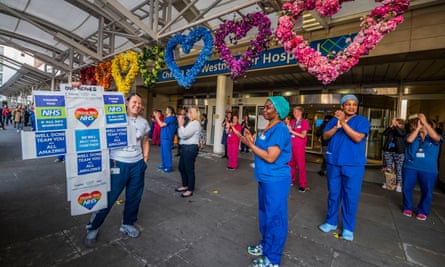 Chelsea and Westminster hospital staff and members of the public applaud the NHS.
