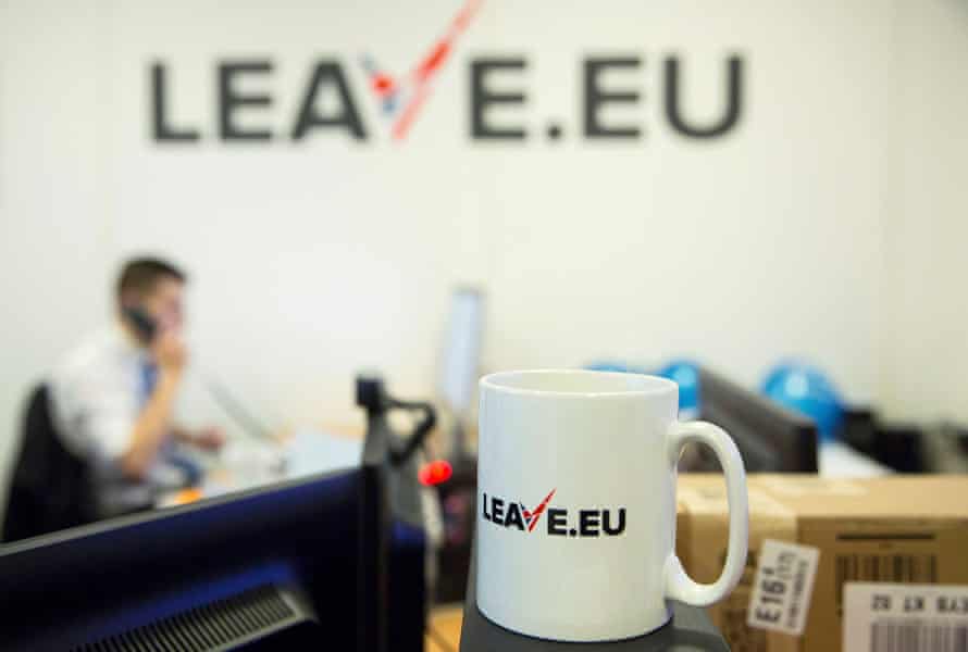 A worker answers a telephone in the office of Brexit group pressure group “Leave.eu” in London