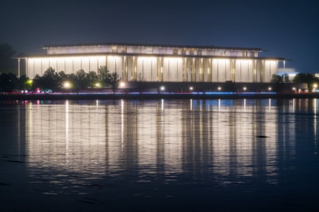 The Kennedy Center for the Performing Arts is reflected in the Potomac River