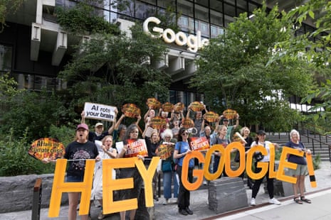 A group of protesters standing outside Google headquarters in New York holding a sign that says 'HEY GOOGLE'