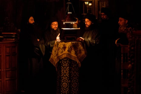 Monks chant a prayer at a midnight service