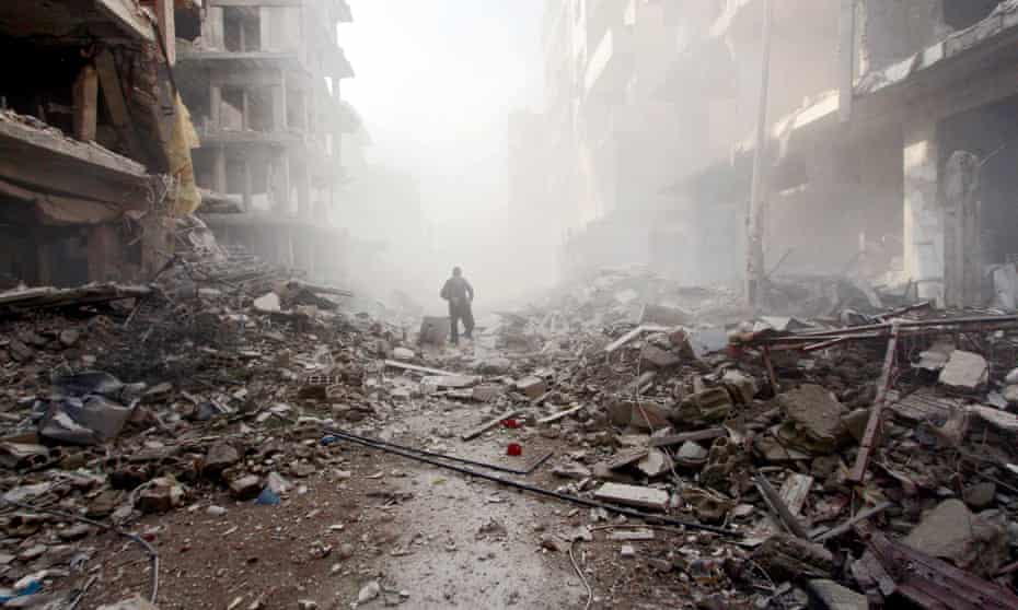 Man among the rubble in Syria.