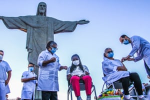 Rio de Janeiro, Brazil: women are inoculated with Sinovac Biotech’s CoronaVac vaccine at the Christ The Redeemer statue on Corcovado mountain