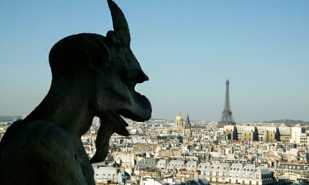Gargoyles look down from Notre Dame Cathedral in Paris, France.