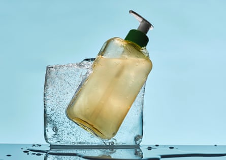 A block of ice with a bottle of moisturiser inside it