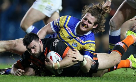Leeds Rhinos’ Anthony Mullally tackles Castleford Tigers’ Mike McMeeken during the Super League match at Elland Road.