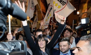 Chiara Appendino celebrates her victory with supporters in Turin.