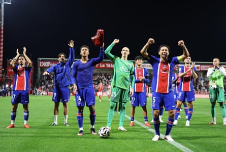 Matvey Safonov celebrates with his teammates after the Ligue 1 match between PSG and Brest