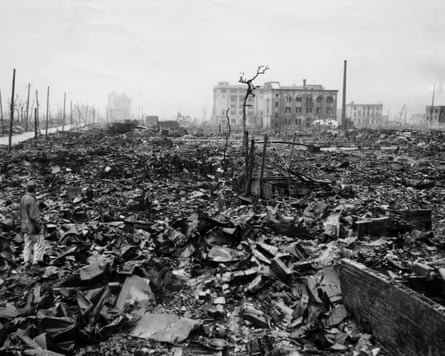 Black and white image of rubble strewn across the landscape