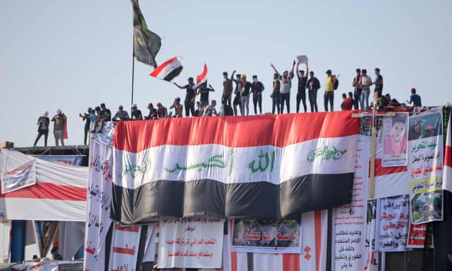 Anti-government protests take to the roof of a building in Baghdad, 2 November 2019. 