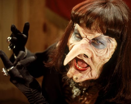 an unrecognisable Anjelica Huston in the witches