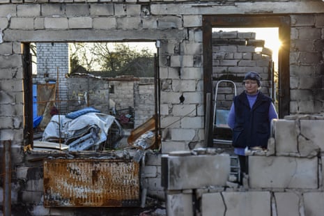 Iryna Terekhova (55) stands in the entrance to her destroyed house in Lukashivka village, Chernihiv.