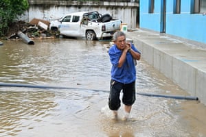 A man salvages items in a flood-hit area in northern Beijing.