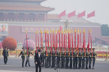 Members of the military rehearse before Donald Trump is greeted by Xi Jinping.