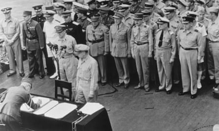 General of the Army Douglas MacArthur and General Wainwright witness the formal Japanese surrender signatures aboard the USS Missouri in Tokyo Bay, 2 September 1945.