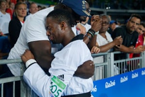 Lutalo Muhammed of Great Britain cries into a friend’s arms after he lost his gold medal taekwondo bout in the last second during day fourteen of the 2016 Olympics in Rio de Janiero