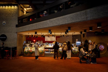 People queue at a coffee shop