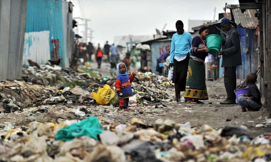 A rubbish-strewn alleyway in Mukuru
