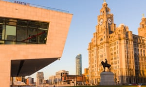 A view of Liverpool's Pier Head waterfront area, with the ferry terminal, the Liver building and a statue of Edward VII