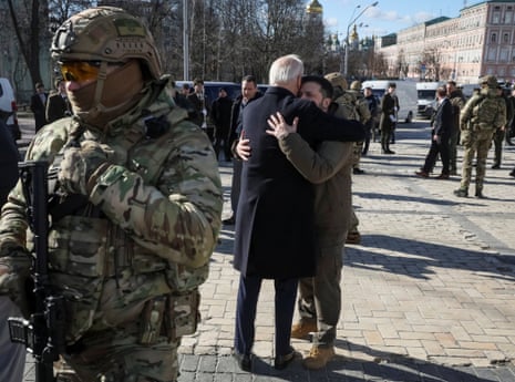 Biden and Zelenskiy embrace after their visit to the Wall of Remembrance to pay tribute to killed Ukrainian soldiers.