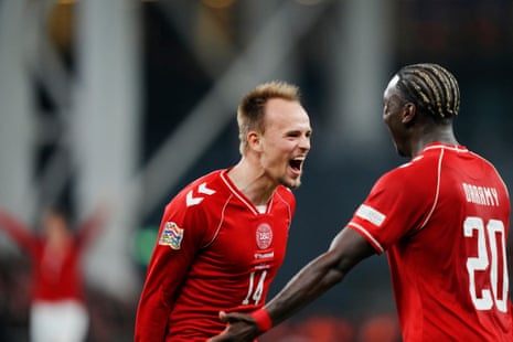 Mikkel Damsgaard (left) celebrates scoring Denmark’s equaliser with teammate Mohamed Daramy.