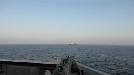 A view of Iranian-flagged cargo ship Touska as USS Spruance (DDG 111) conduts its interception in a location given as the north Arabian Sea.