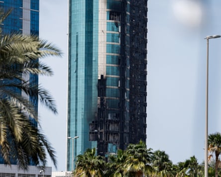 A blackened high-rise block