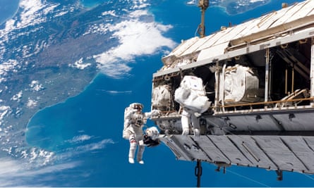 Astronauts spacewalking outside the ISS.