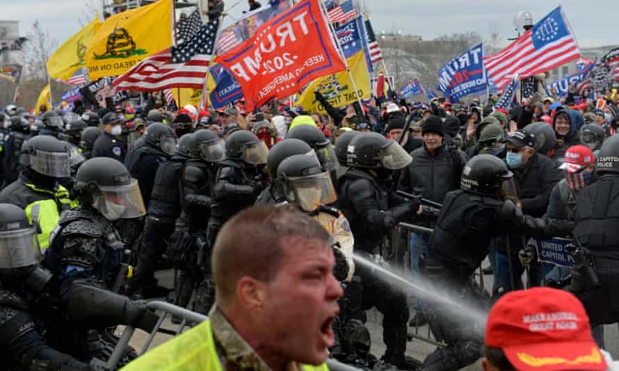 Trump supporters clash with security forces as they storm the US Capitol in Washington DC on 6 January 2021.