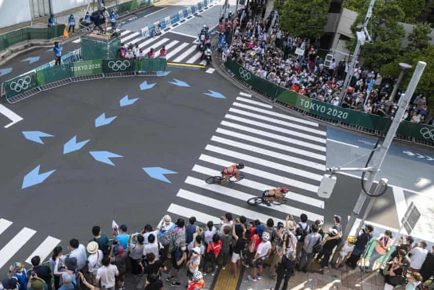 Spectators watch the mixed relay triathlon competition at the Odaiba Marine Park