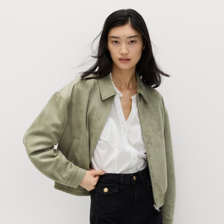 A model wears a sage green suedette harrington jacket