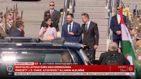 A screenshot from Hungarian M1 TV shows US vice-president JD Vance and his wife, Usha, arrive at Budapest airport, welcomed by Hungarian foreign minister Péter Szijjártó
