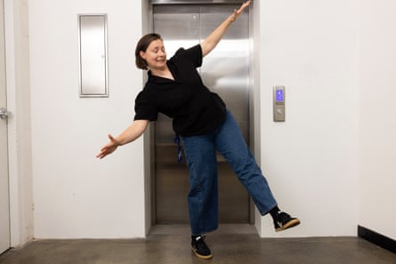 Emma tries to balance on one leg with her eyes closed while waiting for the lift