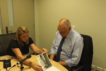 ABC journalist Rachel Brown and retired homicide detective Ron Iddles looking through photos of the crime scene for Trace, a new podcast investigating the 1980 murder of Melbourne mother Maria James. Photo: supplied by the ABC.
