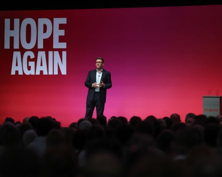 Burnham on stage seen over heads in the audience