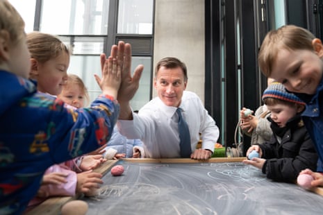Jeremy Hunt with children during a visit to Busy Bees Battersea Nursery in south London this afternoon.
