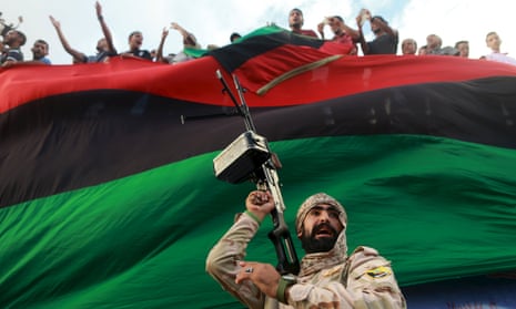 A Libyan soldier protects demonstrators