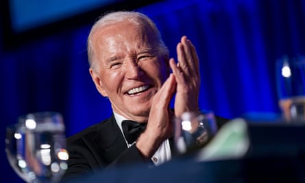 Joe Biden smiling and clapping.